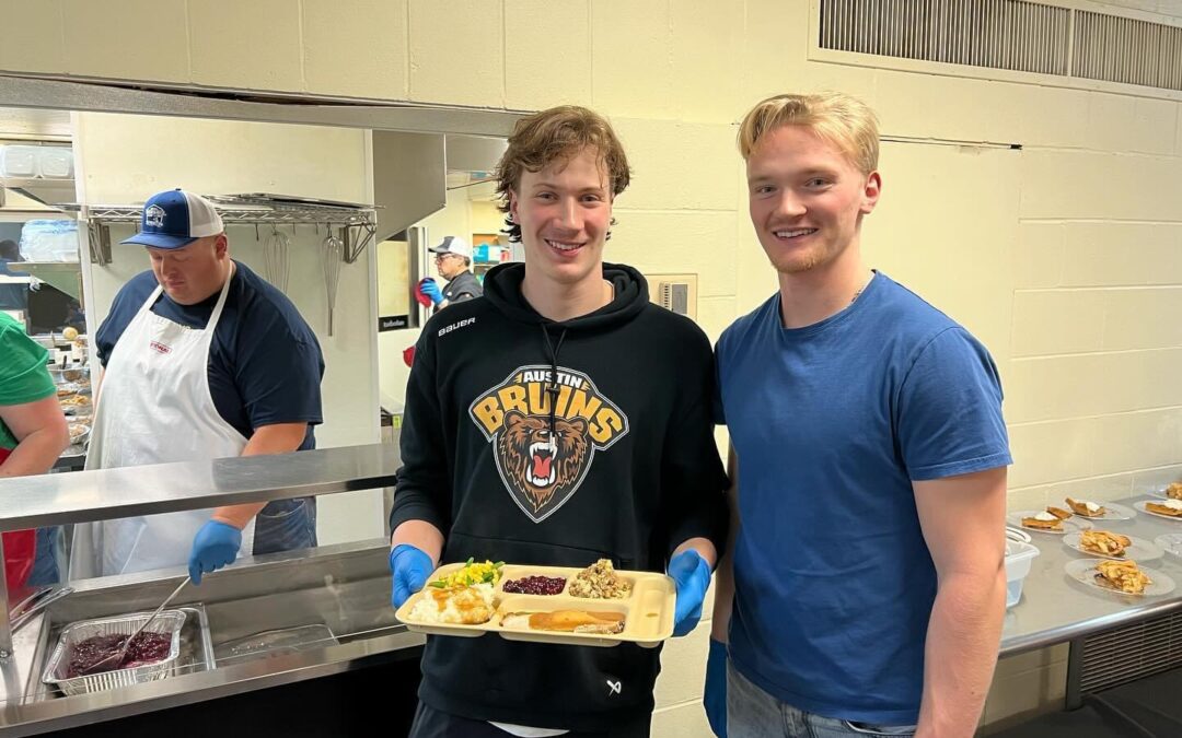 Austin Bruins players serving food at Salvation Army